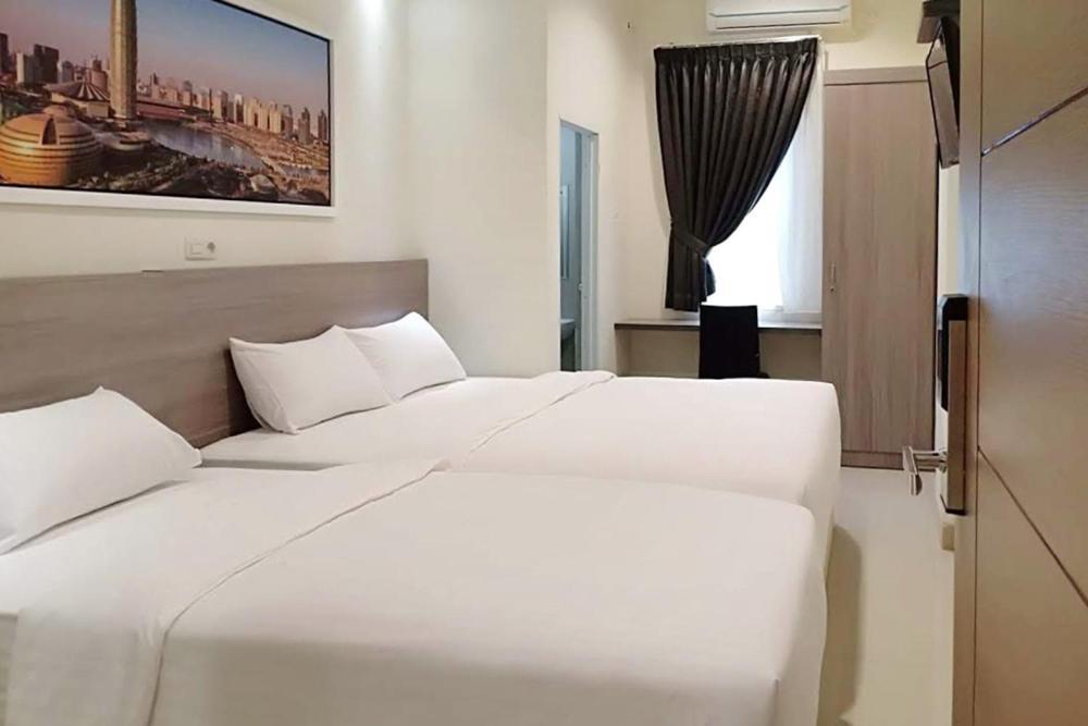 Twospaces Living At Maximus Inn Палембанг Екстериор снимка